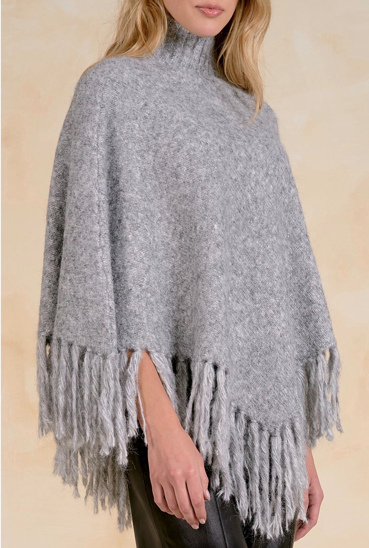 Fringed Turtleneck Poncho Sweater