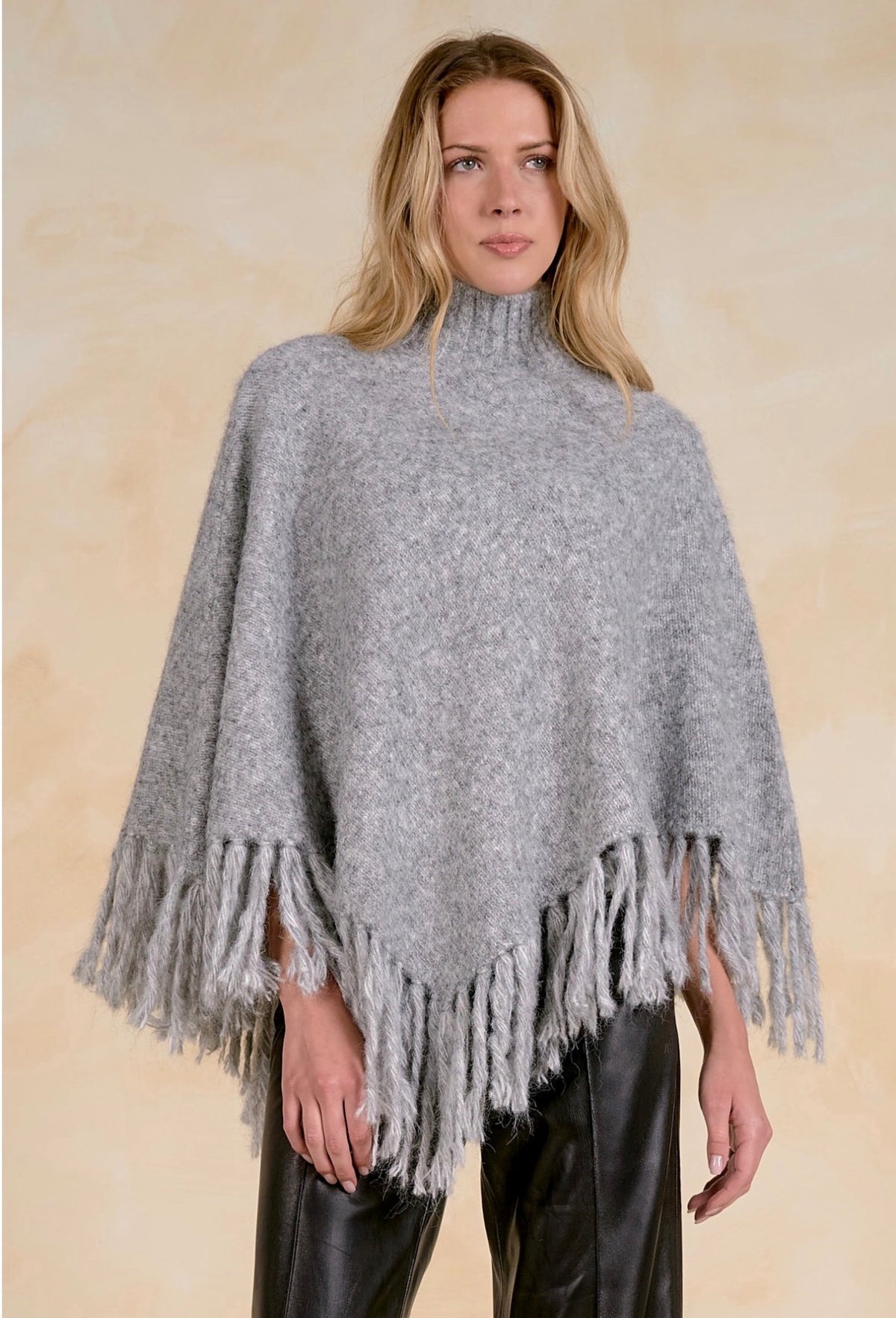Fringed Turtleneck Poncho Sweater