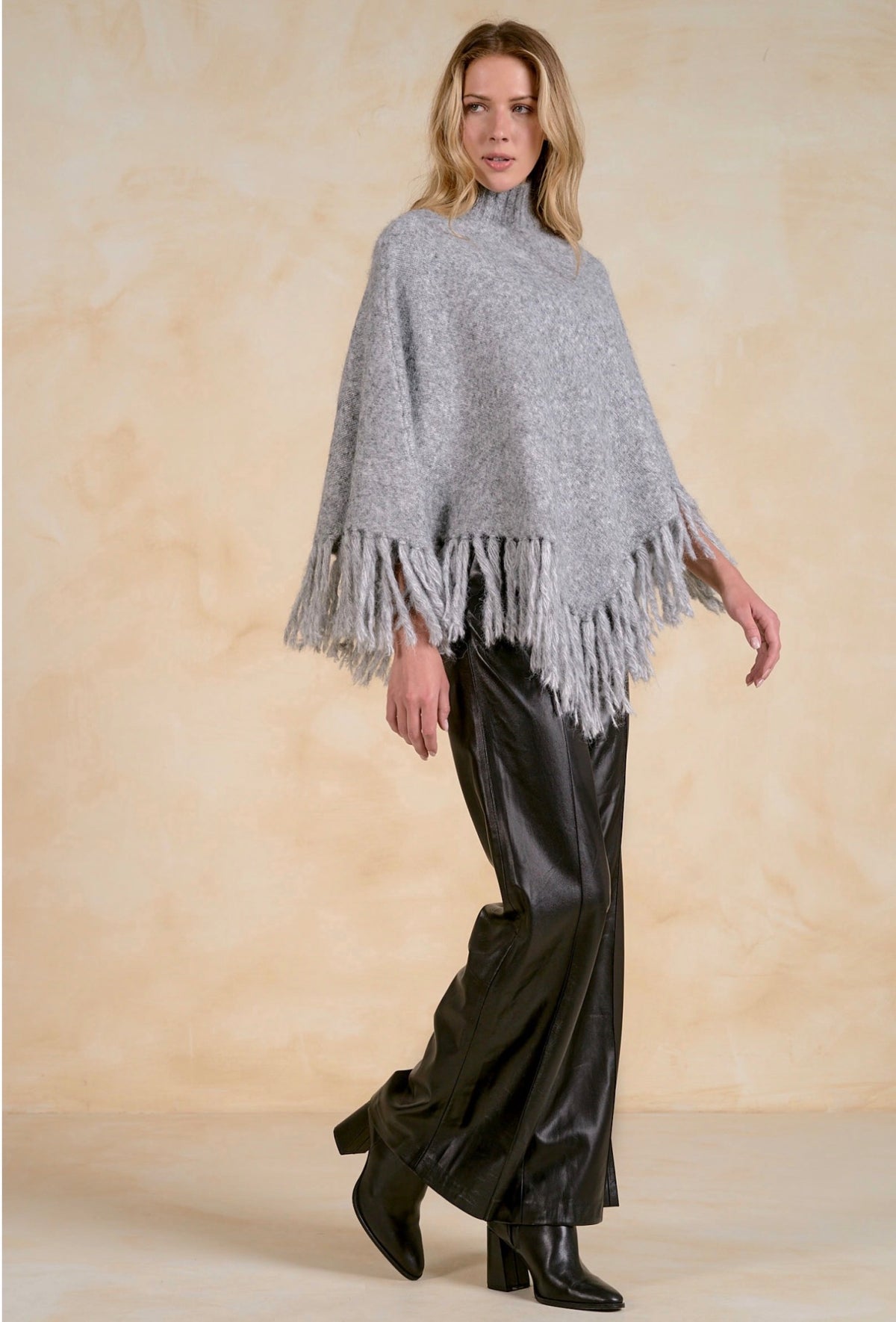 Fringed Turtleneck Poncho Sweater